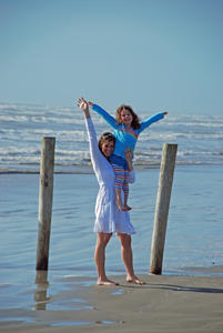 mom and daughter on beach in galveston tx