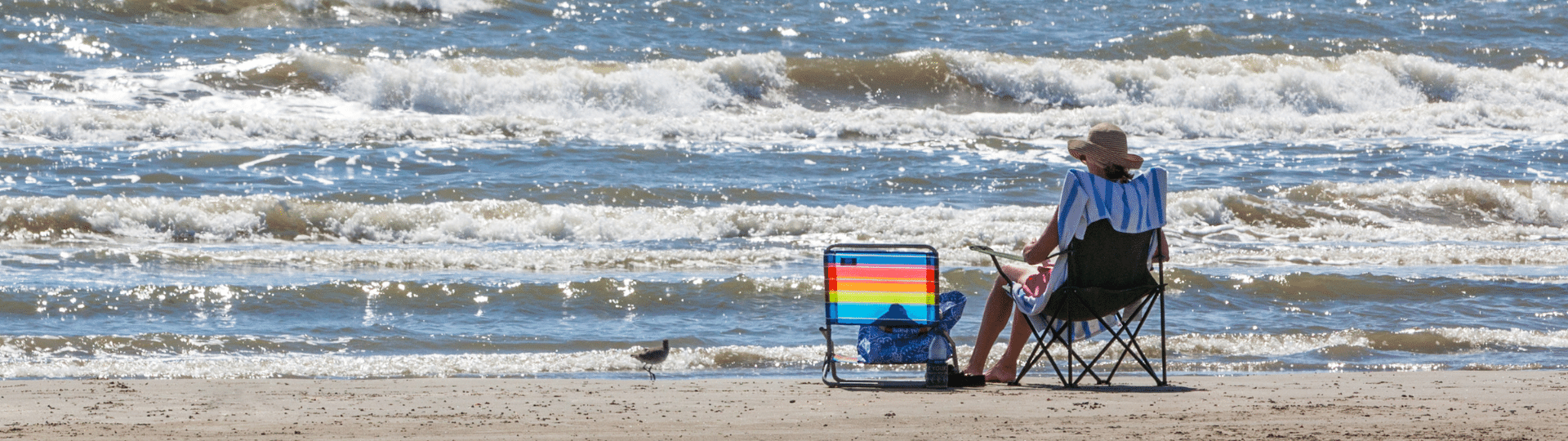 Woman relaxing on the beach in Galveston TX. 