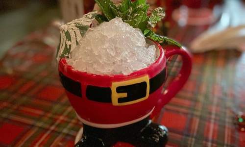 Santa shaped mug holding shaved ice and herbs from Miracle Pop Up Bar